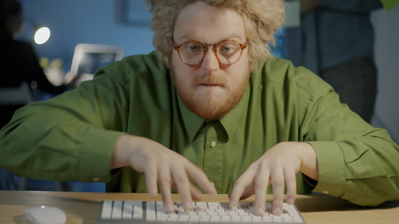 Man Typing on Keyboard, Looking Surprised