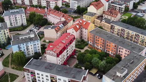 colorful buildings of elk city and bird flying around, aerial view