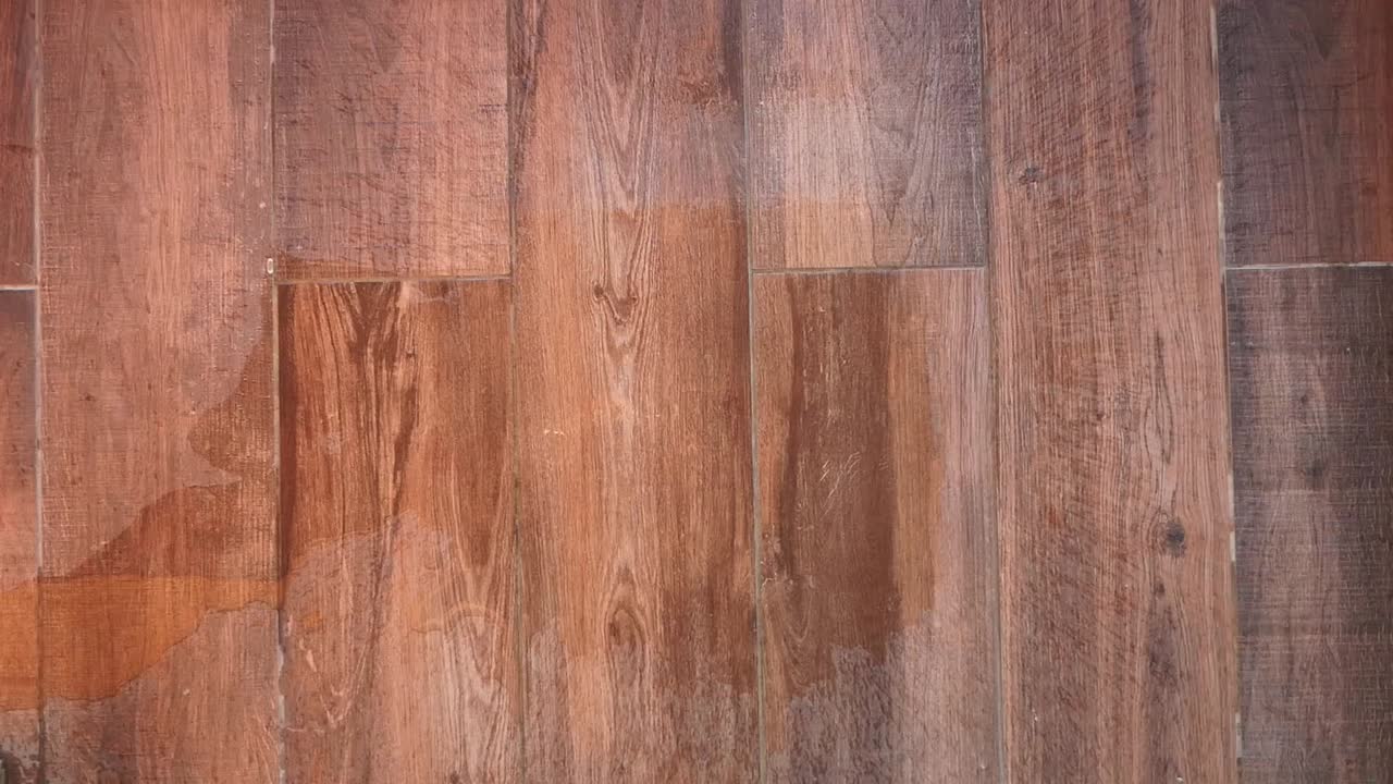 Water flowing on wood flooring