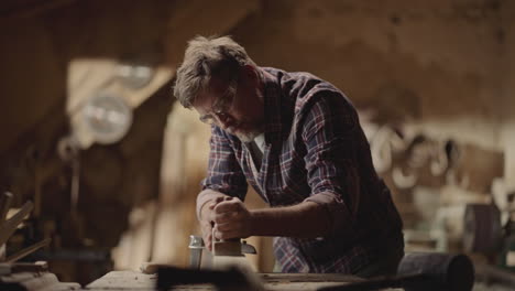 man woodworking in workshop