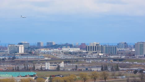 airplane approaching toronto pearson airport with city views