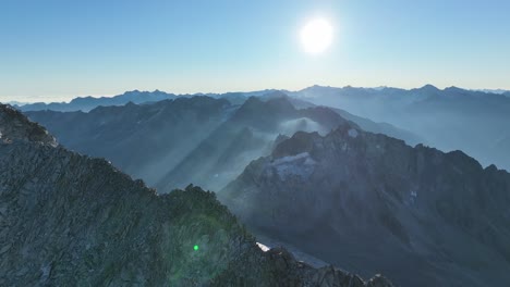aerial footage of a small glacier field and a surrounding mountain ridge in the mountains of south tyrol - italy.
