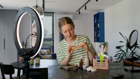 young woman demonstrates skincare routine