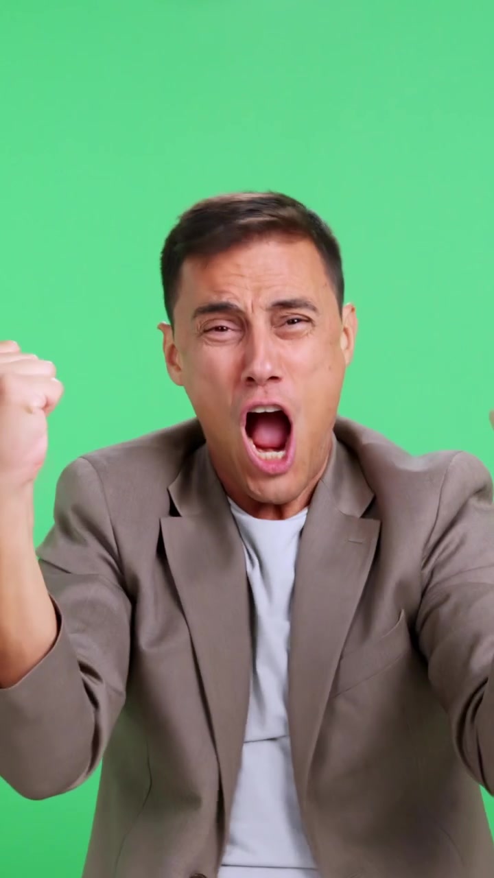Excited businessman screaming and dancing on green screen
