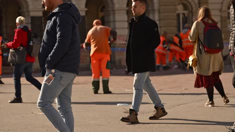street sweeper cleaning town hall building and square after protest over fatal rail