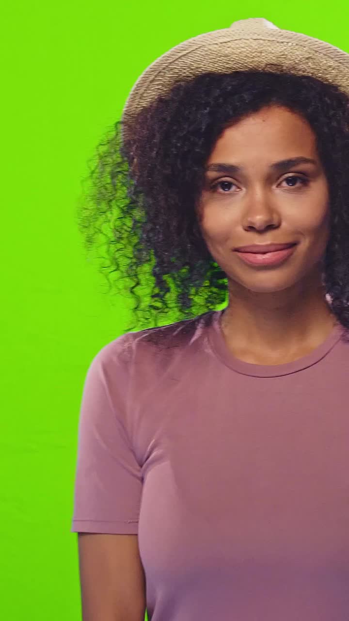 Young smiling beautiful african american woman in summer hat for beach