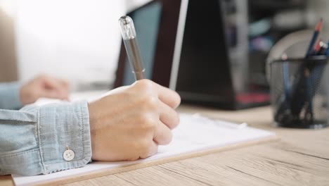 close up shot of businesswoman hands typing on laptop computer keyboard for searching information,online communication support,marketing research,business report in the office desk at night.