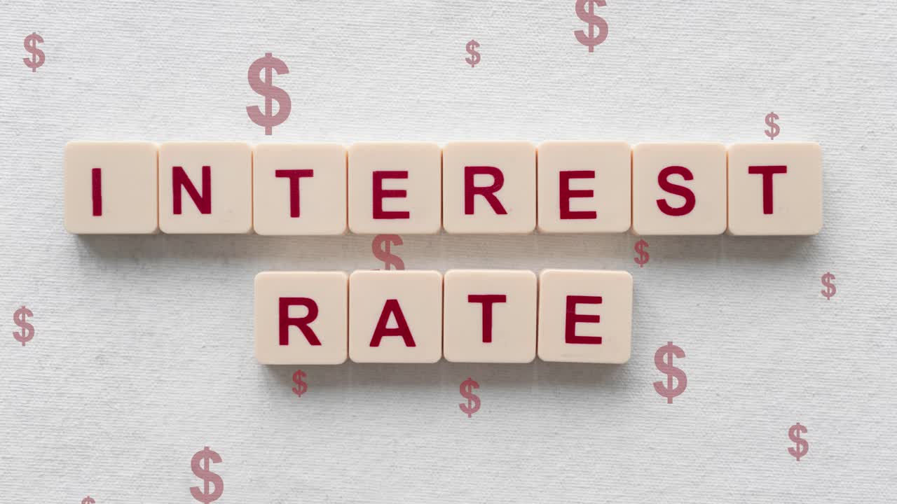 Interest Rate Words Spelled Out On Scrabble Tiles With Red Dollar Signs Going Up