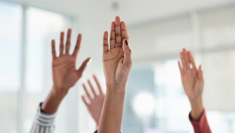 raised hands in a meeting