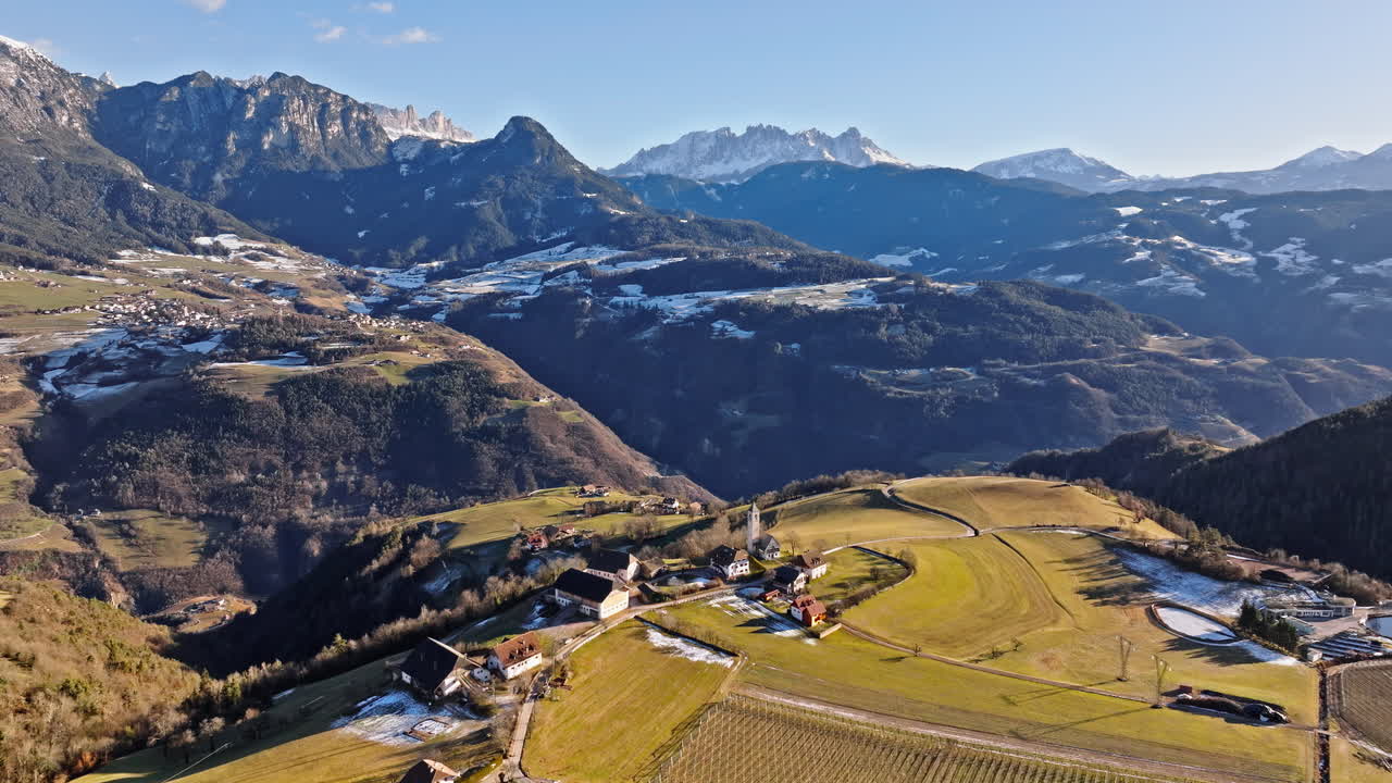 Aerial drone view of the Soprabolzano village on the Renon plateau in the Dolomites, Italy