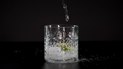 soda poured into glass with ice and lime