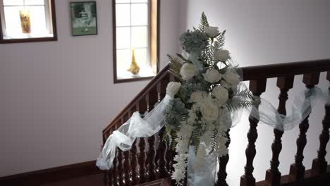 elegant staircase decorated with white roses and tulle for wedding location irrelevant