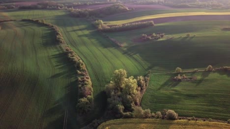 aerial view of a farmland on rolling hills in poland