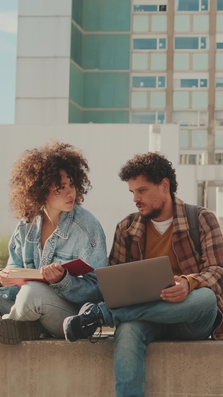 Two Students Studying Together on Campus