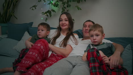 Family-Watching-Tv.-Family-With-Children-Sitting-On-Sofa-In-Living-Room.-High-quality-4k-footage