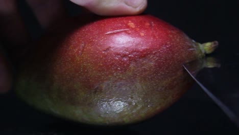 cutting mango in a half