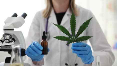 scientist or doctor researching cannabis and cbd oil in a lab