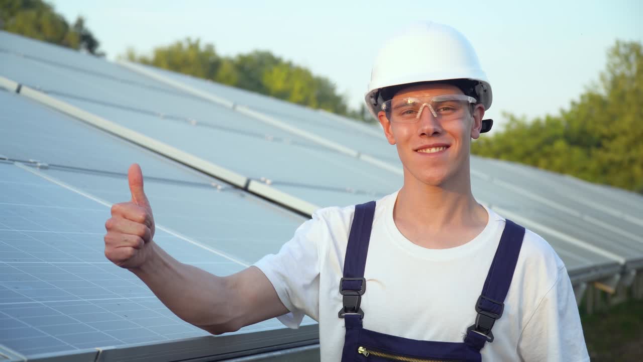 Solar panel technician in a solar power station. Green energy concept