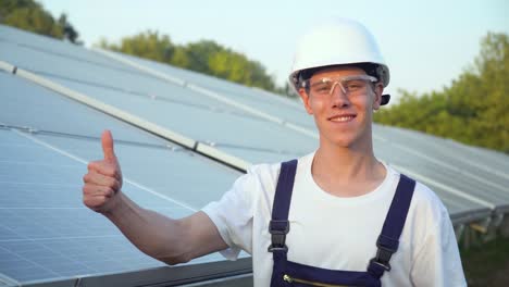 solar panel technician in a solar power station. green energy concept