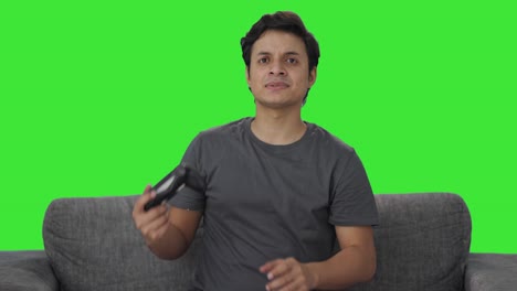 upset indian man loses a match in video game green screen