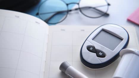 blood glucose meter on a desk