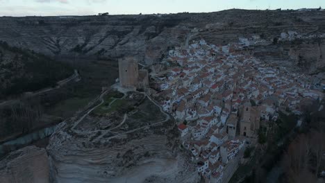 orbiting drone movement the castle of the medieval village of alcalá del jucar, spain, one of the most beautiful villages in spain