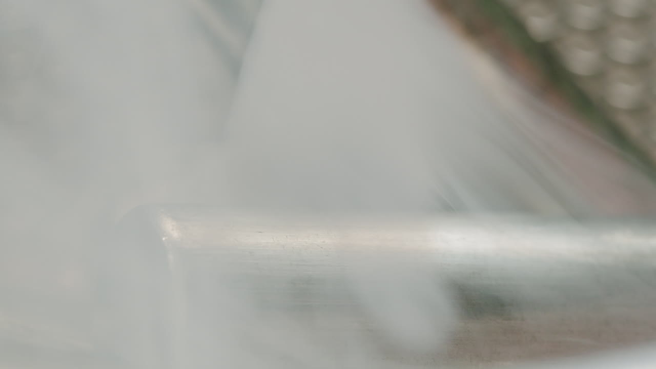 Silver batteries AA and AAA in wastebasket with smoke around close-up. Double-A battery is a standard size single cell cylindrical dry battery. Batteries are common in portable electronic devices. Environmental impacts of lithium-ion batteries concept. An AA battery is composed of a single electroch