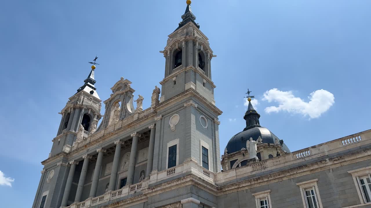 Side view of Almudena Cathedral on a sunny day, elegant and majestic