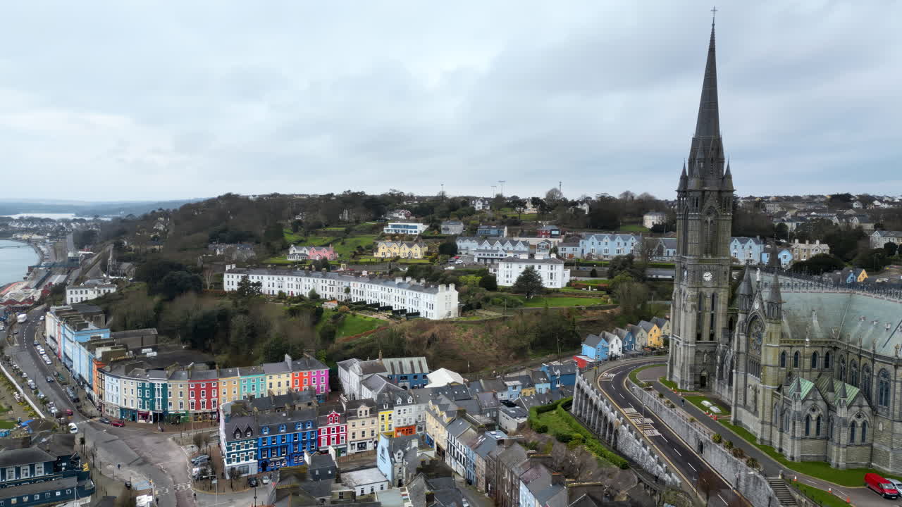 Aerial drone view of the colourful houses surrounding the St Colman's Cathedral in Cork, Ireland