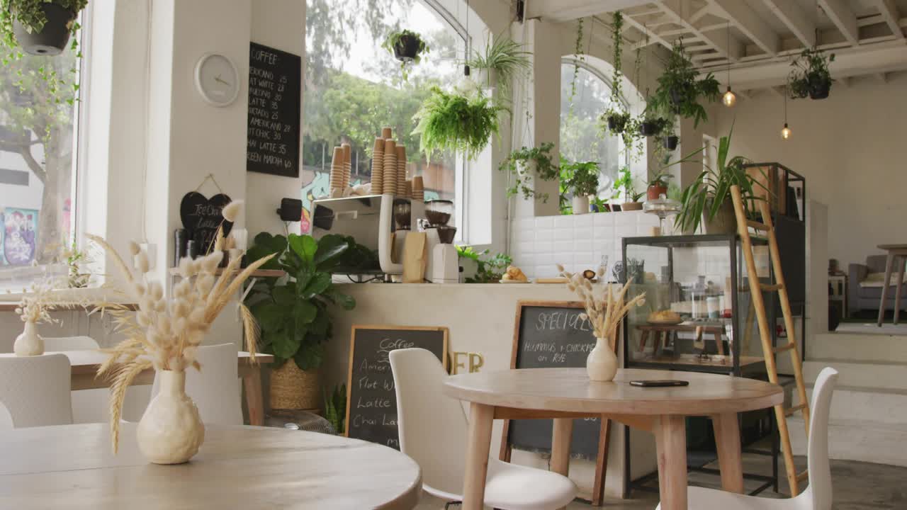 Holographic blue overlays appearing top center, drifting over round table phone showing cafe UI
