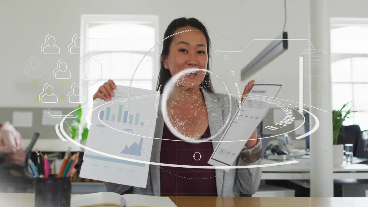 Office professional woman presenting finance charts at desk, showing animated circular data overlay