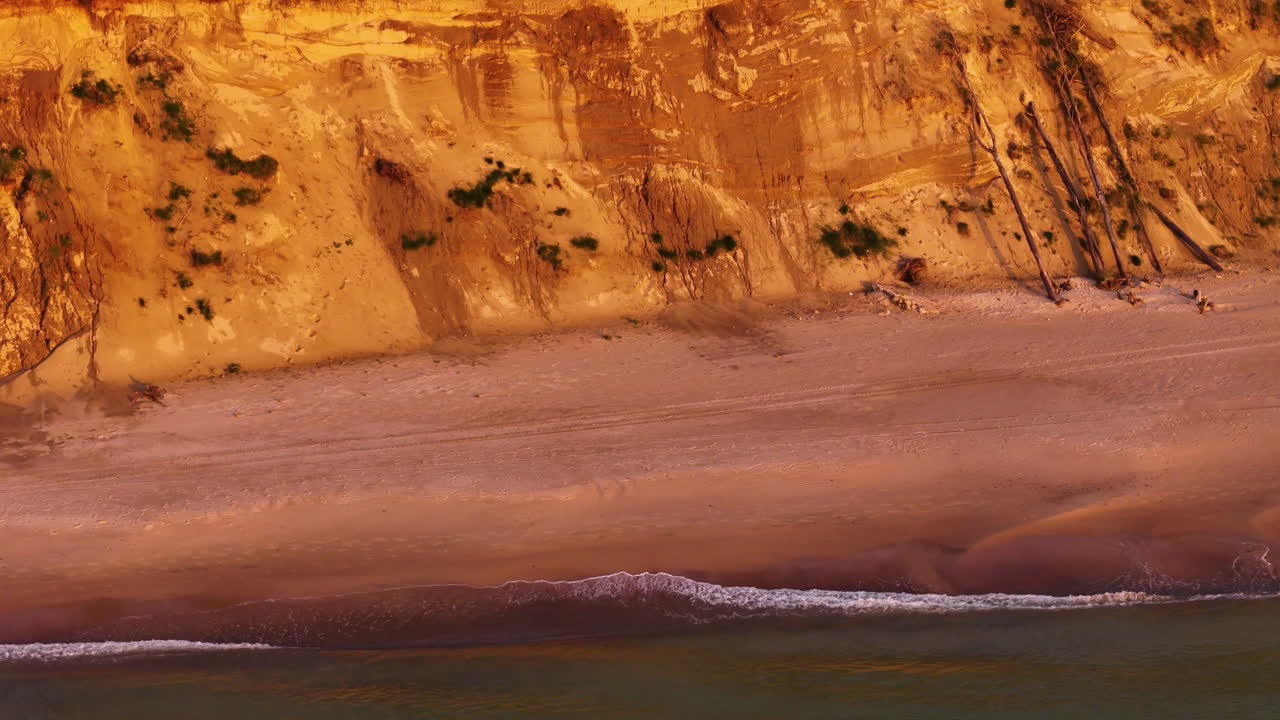 Aerial Drone Revealing A Shrinking Beach Along The Steep Banks Of Jurkalne, Latvia. Climate Change Playing A Major Role In The Drastic Environmental Changes To The Coastal Landscape.