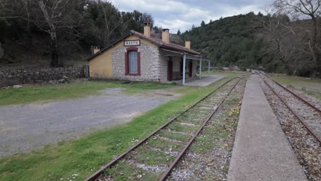 tracks on abandoned railway station in peloponnese, greece