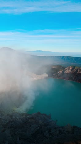 vertical view of kawah ijen in the crater of volcano at sunrise in east java, indonesia. - aerial shot