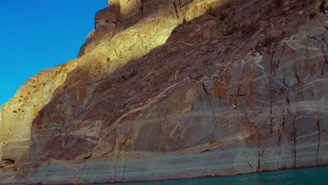 Hikes-that-end-at-the-edge-of-a-mountain-lake,-the-sapphire-waters-next-to-an-exposed-Rocky-Mountain-backdrop-are-ceaselessly-enticing-to-every-visitor