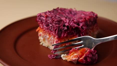 a piece of russian salad (vichyssoise) with fork