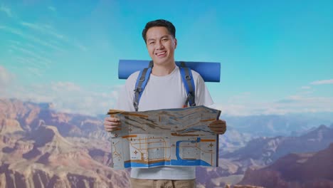 asian male hiker with mountaineering backpack looking at the map then smiling to camera while traveling at the top of mountain