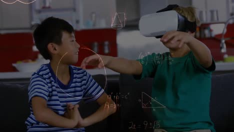 Boy-wearing-a-virtual-reality-headset-playing-with-a-friend