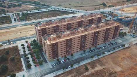 aerial view of a new building in the outskirts of a city