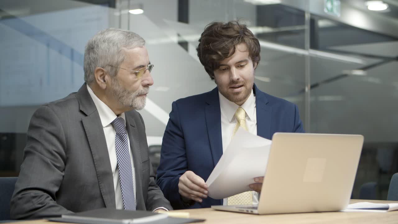 Young consultant explaining details of contract
