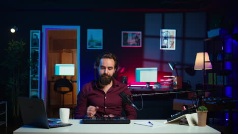 artist filming dj mixing tutorial on sound controller