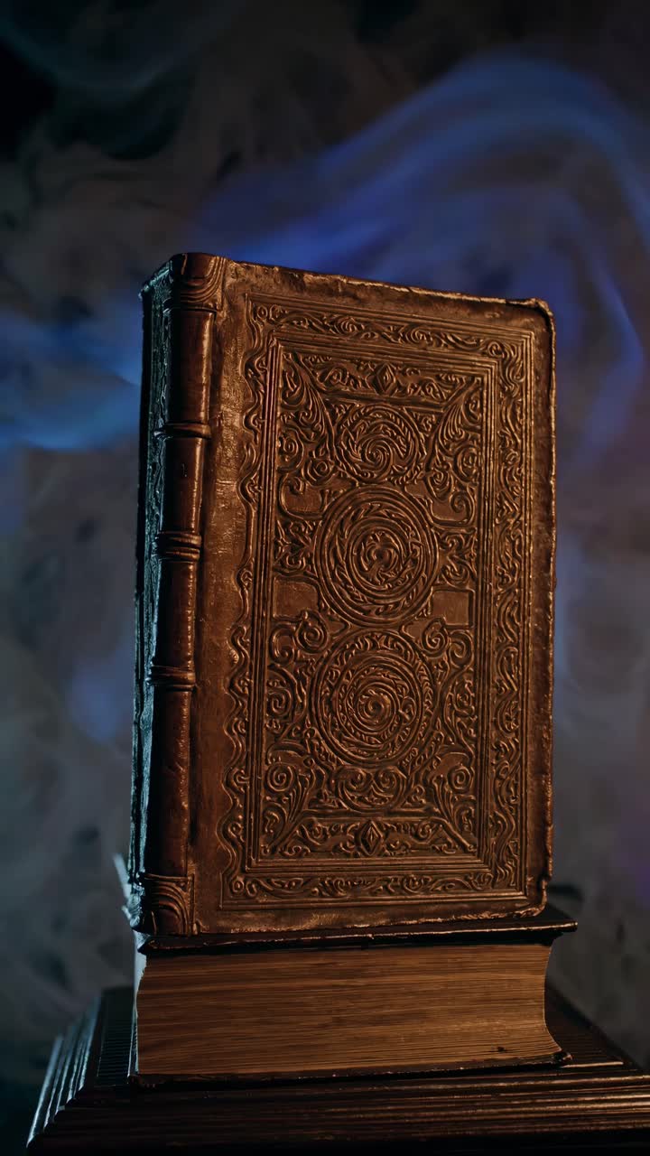 A mystical book surrounded by swirling smoke, captured from a low-angle