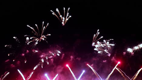 Colorful-fireworks-exploding-in-the-night-sky.-Celebrations-and-events-in-bright-colors.