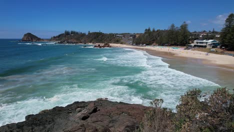 idyllic scenery of the beach during summer in flynns beach, new south wales, australia - drone shot