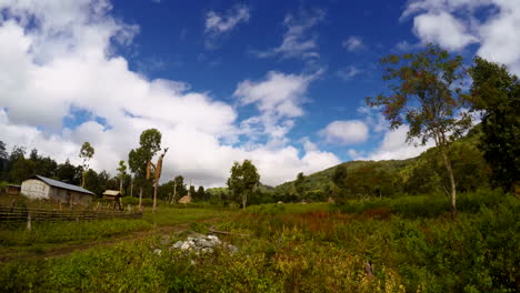 timelapse of clouds moving over the green nature in east timor village