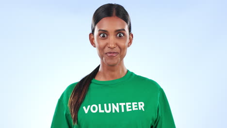 Volunteer-woman,-face-and-wow-in-studio