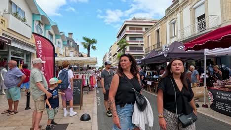 people shopping for clothing and swimwear outdoors