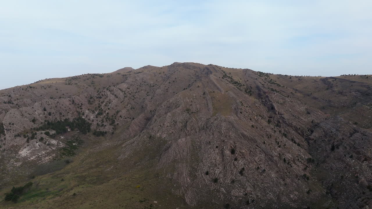 Drone ascends over the breathtaking Sierra de la Ventana mountains, revealing the beautiful ridges and valleys