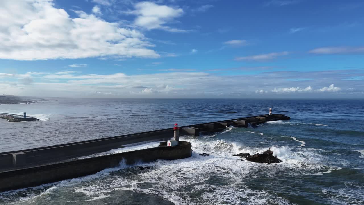 Slow-motion waves crashing near Farolim de Felgueiras in Porto Portugal during sunny day