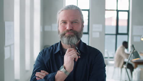 portrait of confident senior businessman in office